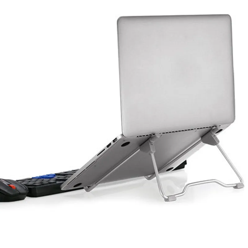 Grey aluminium alloy adjustable phone and laptop stand on desk
