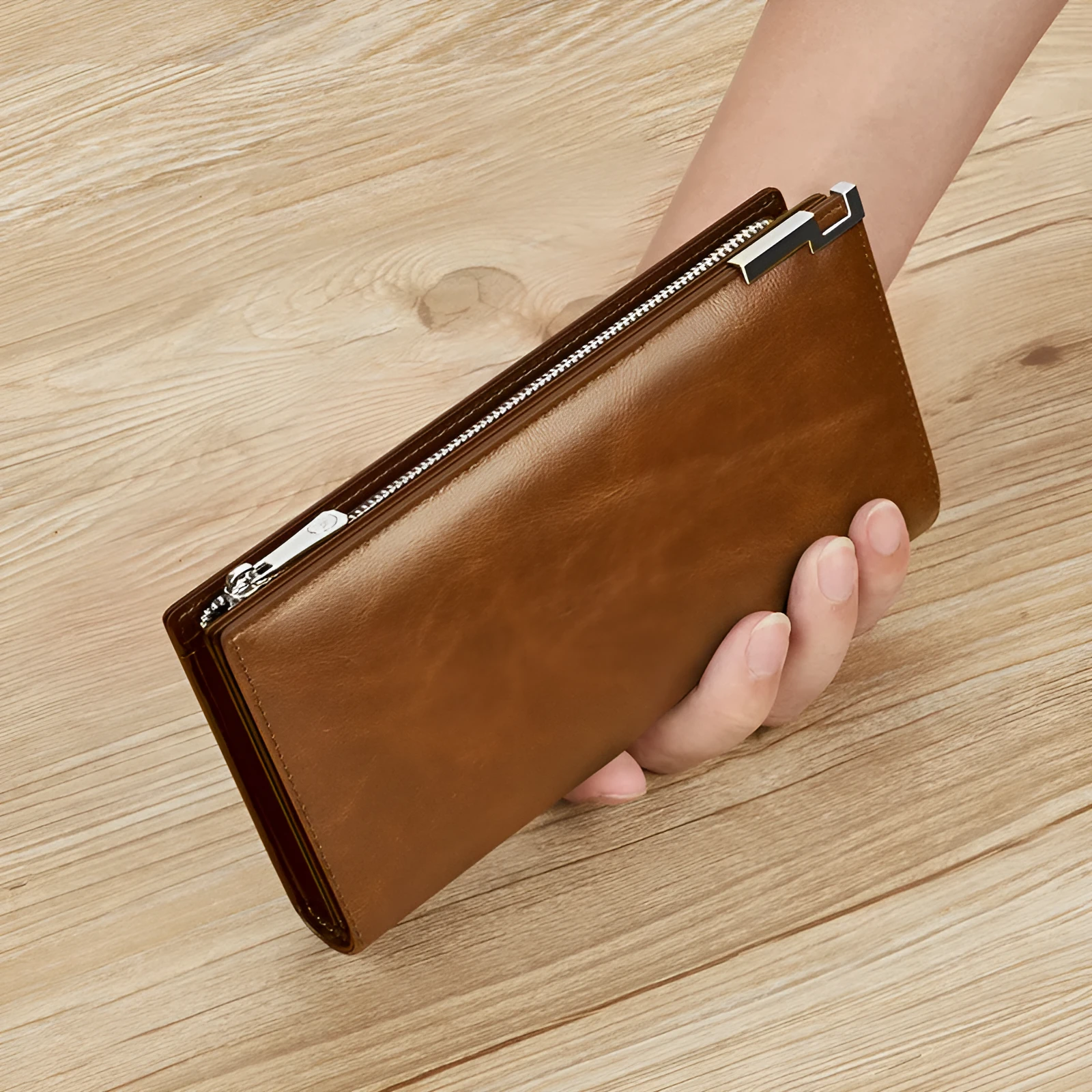 Brown solid colour cowhide leather wallet with contrast stitching laid open showing card slots and cash compartment