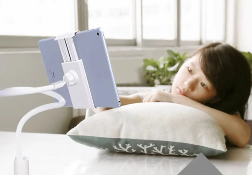Blue universal mobile phone holder with 120cm pole clamped to bedside table holding a tablet