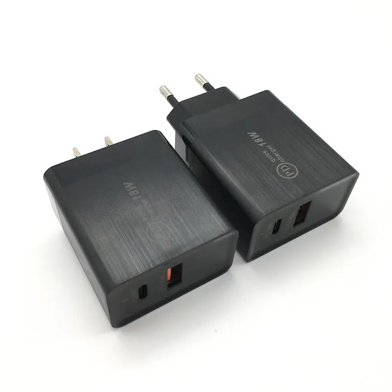 White 18W USB-C PD fast charger wall adapter with US plug on a table.