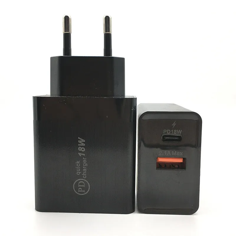 White 18W USB-C PD fast charger wall adapter with US plug on a table.