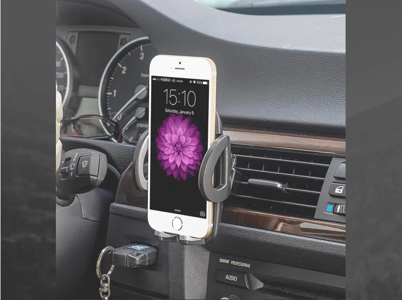 Black plastic car air conditioning outlet mobile phone holder mounted in vehicle vent