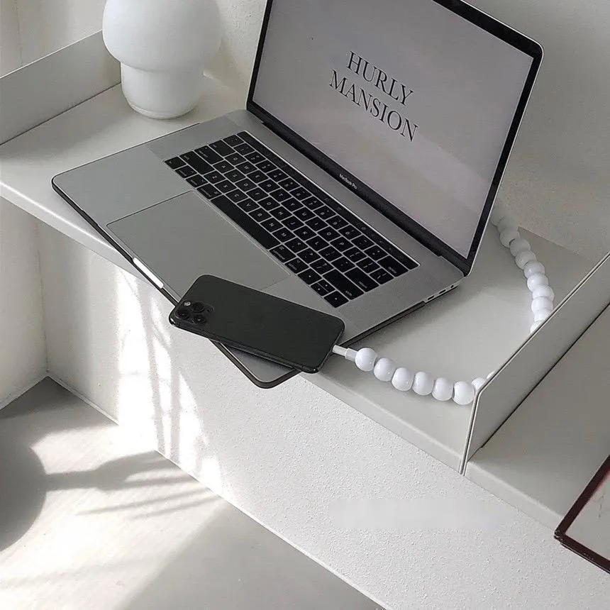 Mint green USB data cable with straight head connector on a white background