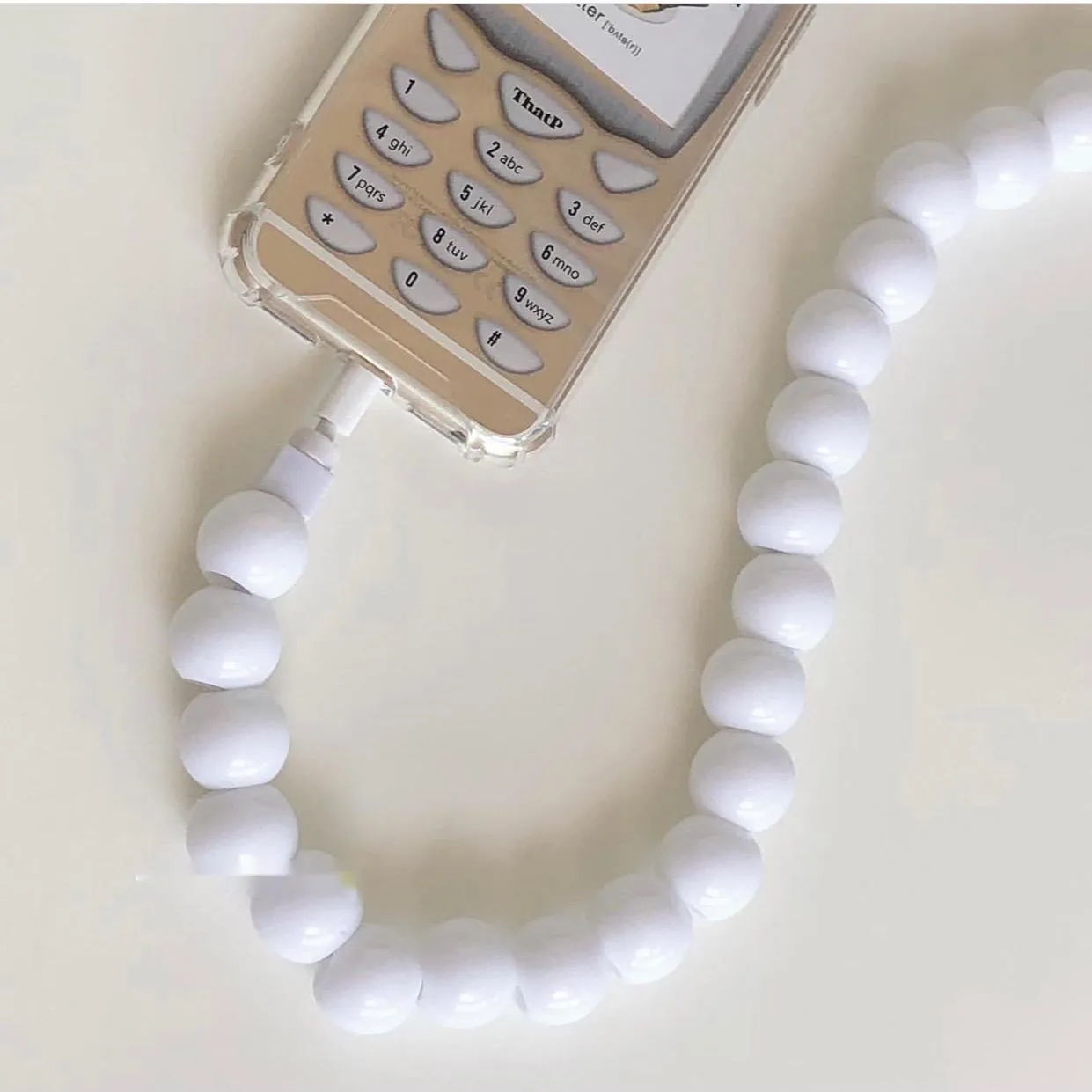 Mint green USB data cable with straight head connector on a white background