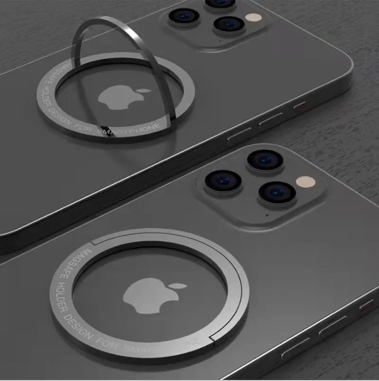 Round zinc alloy mobile phone holder on a desk, 56mm diameter, available in black or silver