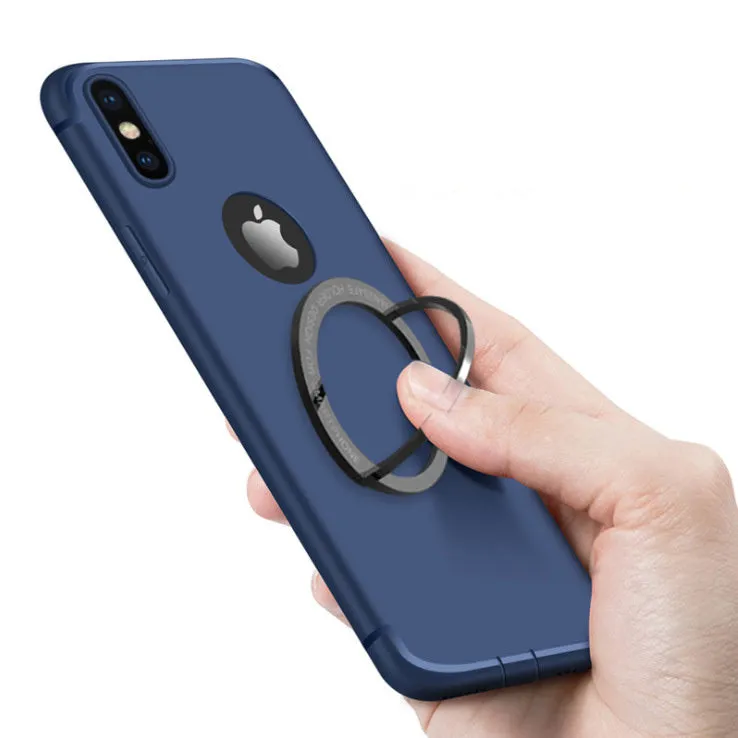 Round zinc alloy mobile phone holder on a desk, 56mm diameter, available in black or silver