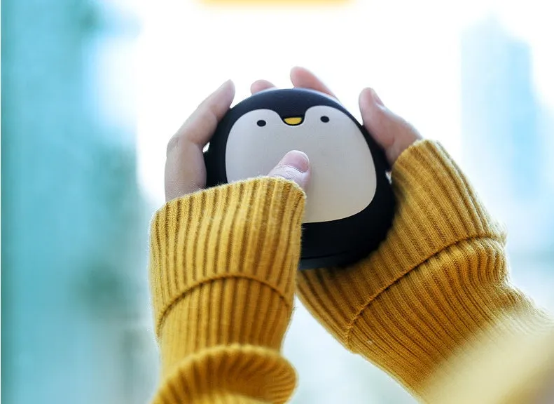Cute cartoon penguin and polar bear design USB rechargeable hand warmer and power bank unit.