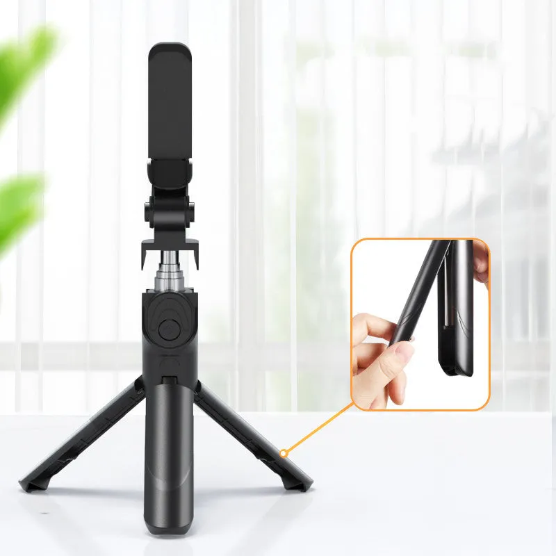 Selfie stick with aluminium alloy body and phone holder in tripod mode on a desk