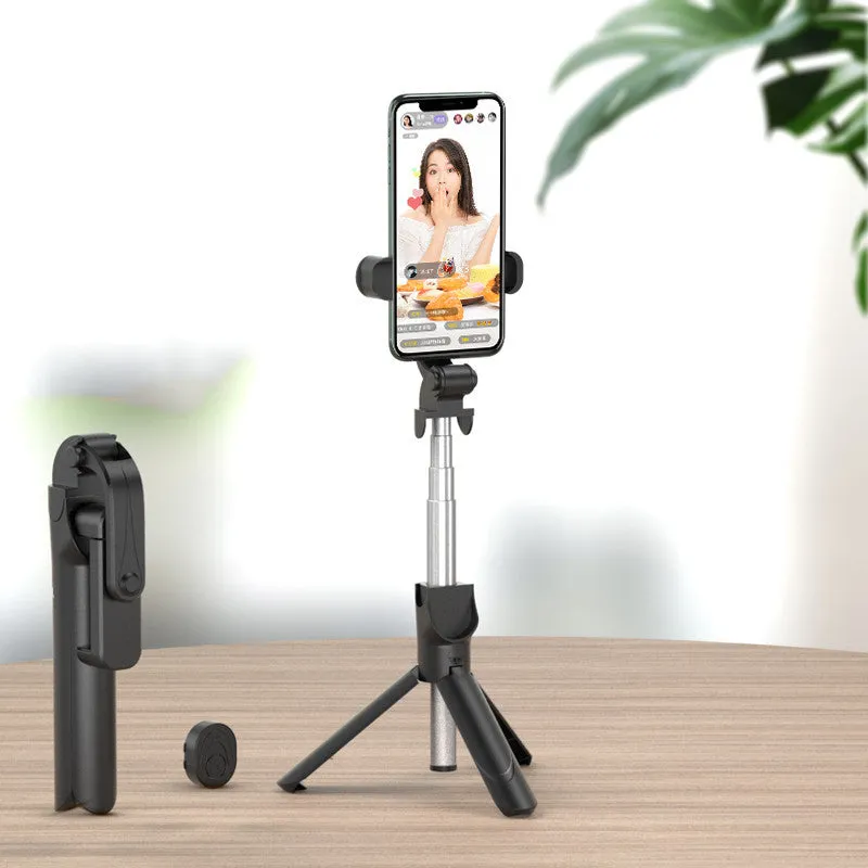 Selfie stick with aluminium alloy body and phone holder in tripod mode on a desk