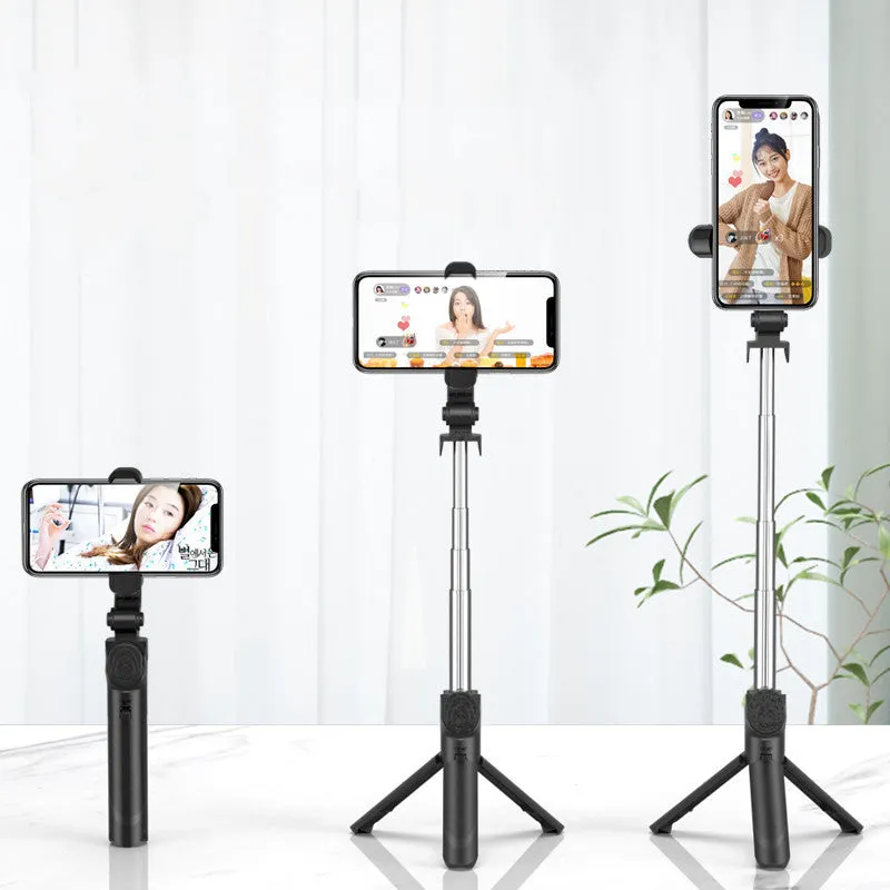 Selfie stick with aluminium alloy body and phone holder in tripod mode on a desk