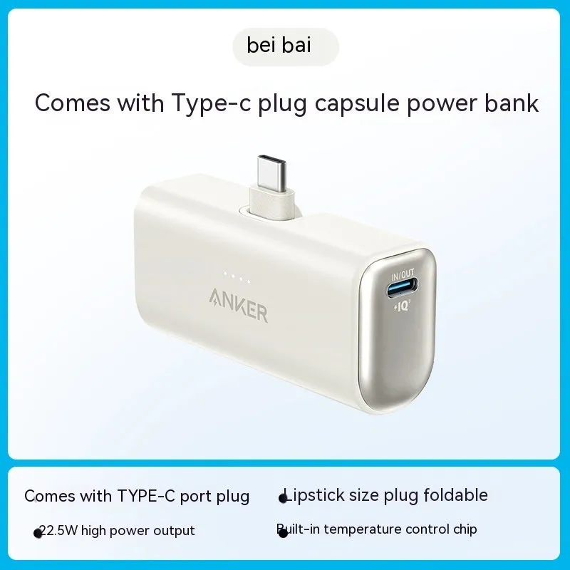 Small capsule-shaped power bank in multiple colours showing built-in foldable USB-C cable and compact size.