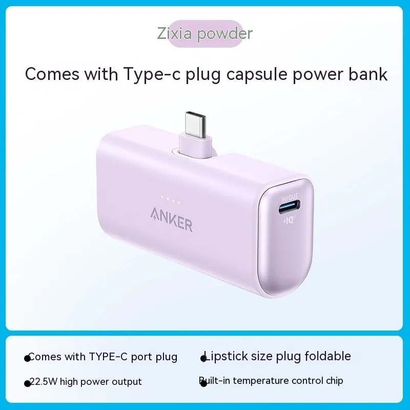 Small capsule-shaped power bank in multiple colours showing built-in foldable USB-C cable and compact size.