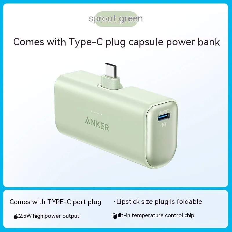 Small capsule-shaped power bank in multiple colours showing built-in foldable USB-C cable and compact size.