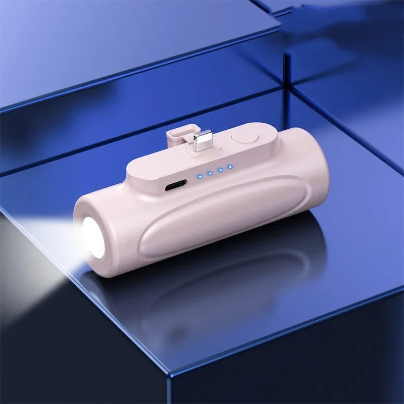 Black and pink portable power bank with a built-in LED flashlight, showing USB-C and Apple port options.