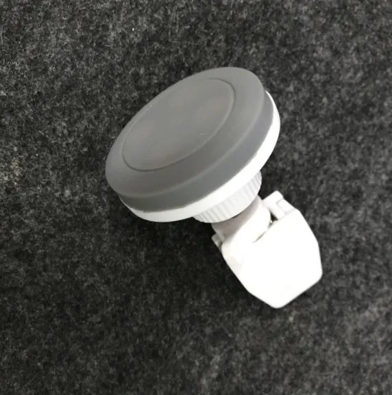 Cross border patented vehicle mounted magnetic handset holder in black, blue, and grey colours for car phone use.