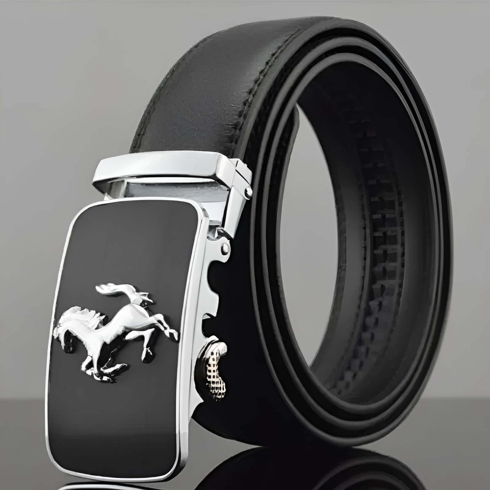 Black men's leather automatic buckle belt with a 3.5cm width on a table.