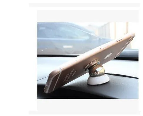 Magnetic car phone mount with paste base in black holding a Samsung phone on dashboard