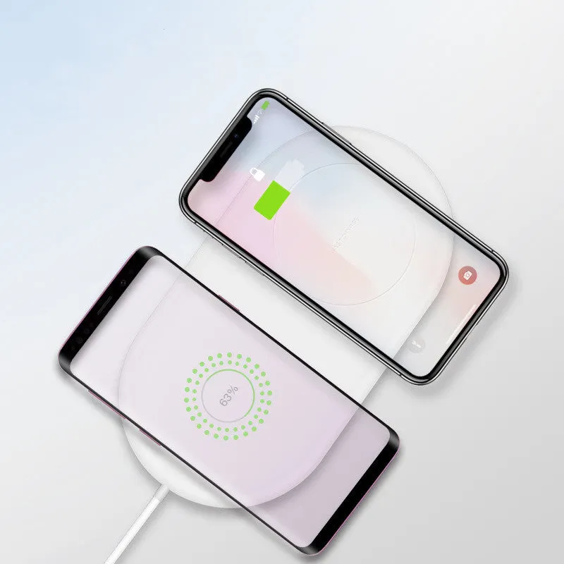 White dual wireless charging pad for two mobile phones on simple design