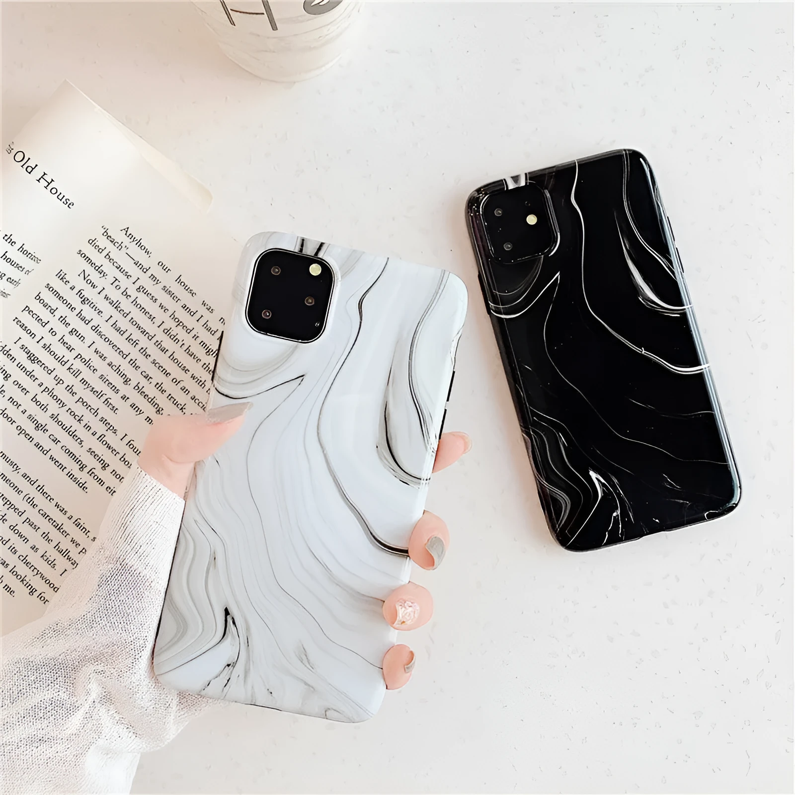 Marble mobile phone case for iPhone in black and white soft shell design, showing fade-resistant pattern