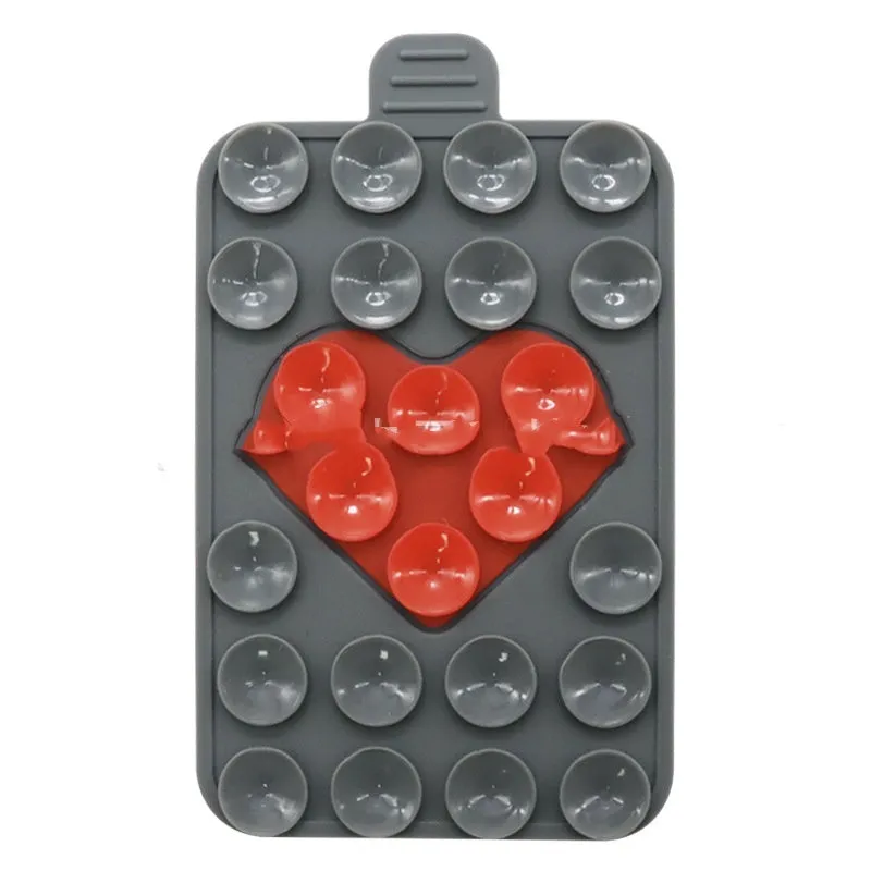 Double sided silicone suction cup phone case holder in gray white, showing hot pressed construction for universal fit on smooth surfaces