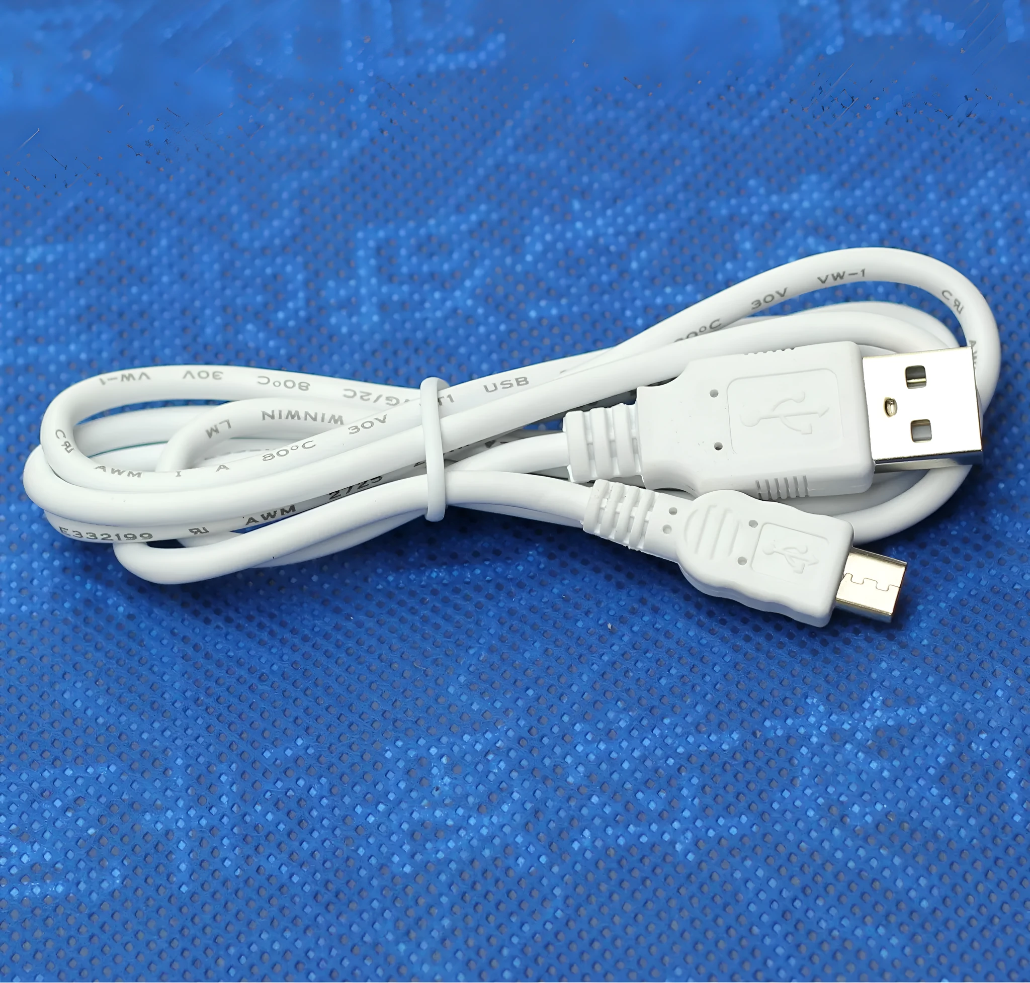 Black USB OTG cable with Mini USB and TYPE-C connectors on white background