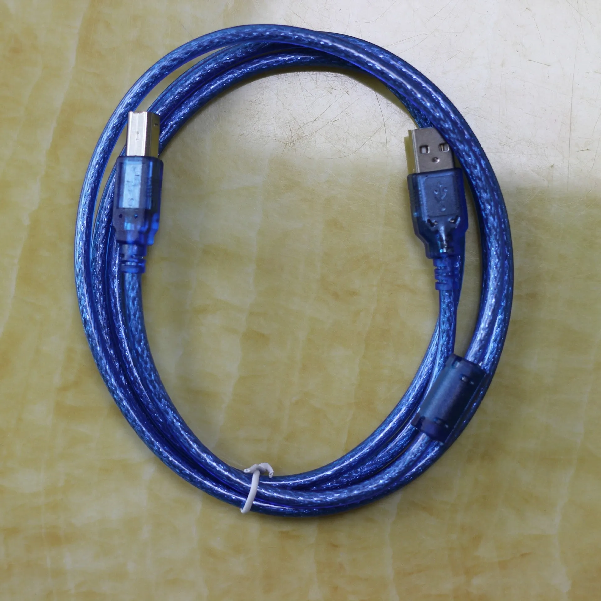 Black USB OTG cable with Mini USB and TYPE-C connectors on white background
