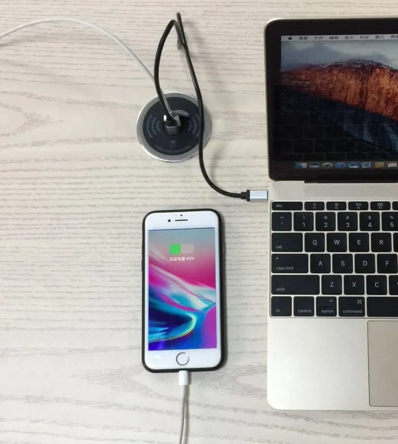 Black desktop embedded Qi wireless charger showing flush installation on a desk surface requiring 60mm hole