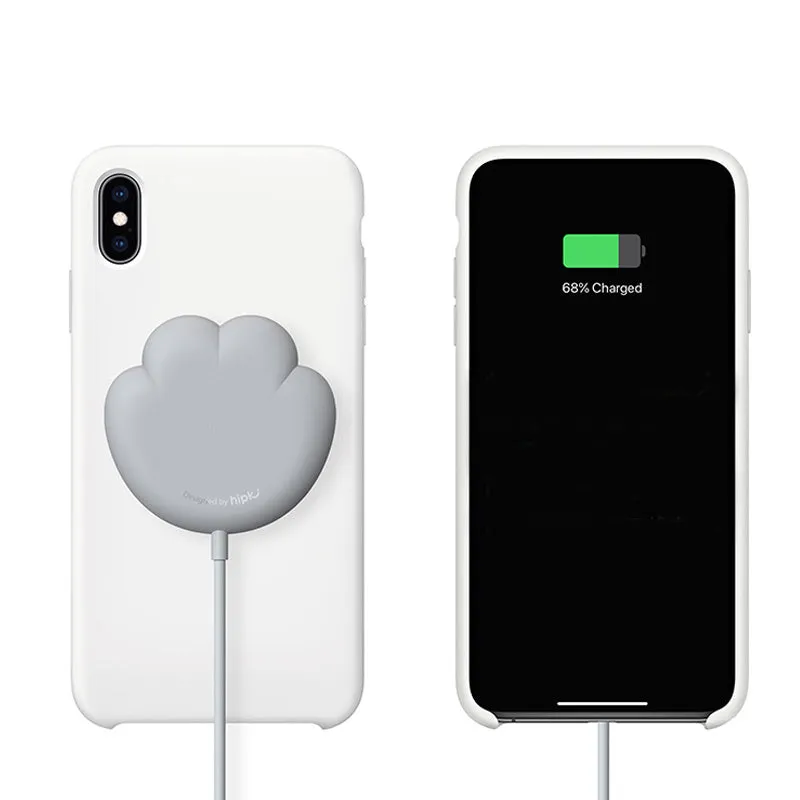 Pink cat claw sucker wireless charger with USB cable on a desk