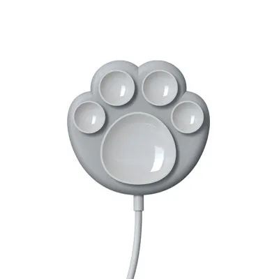 Pink cat claw sucker wireless charger with USB cable on a desk
