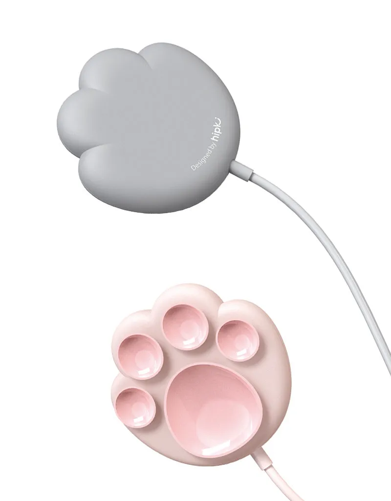 Pink cat claw sucker wireless charger with USB cable on a desk