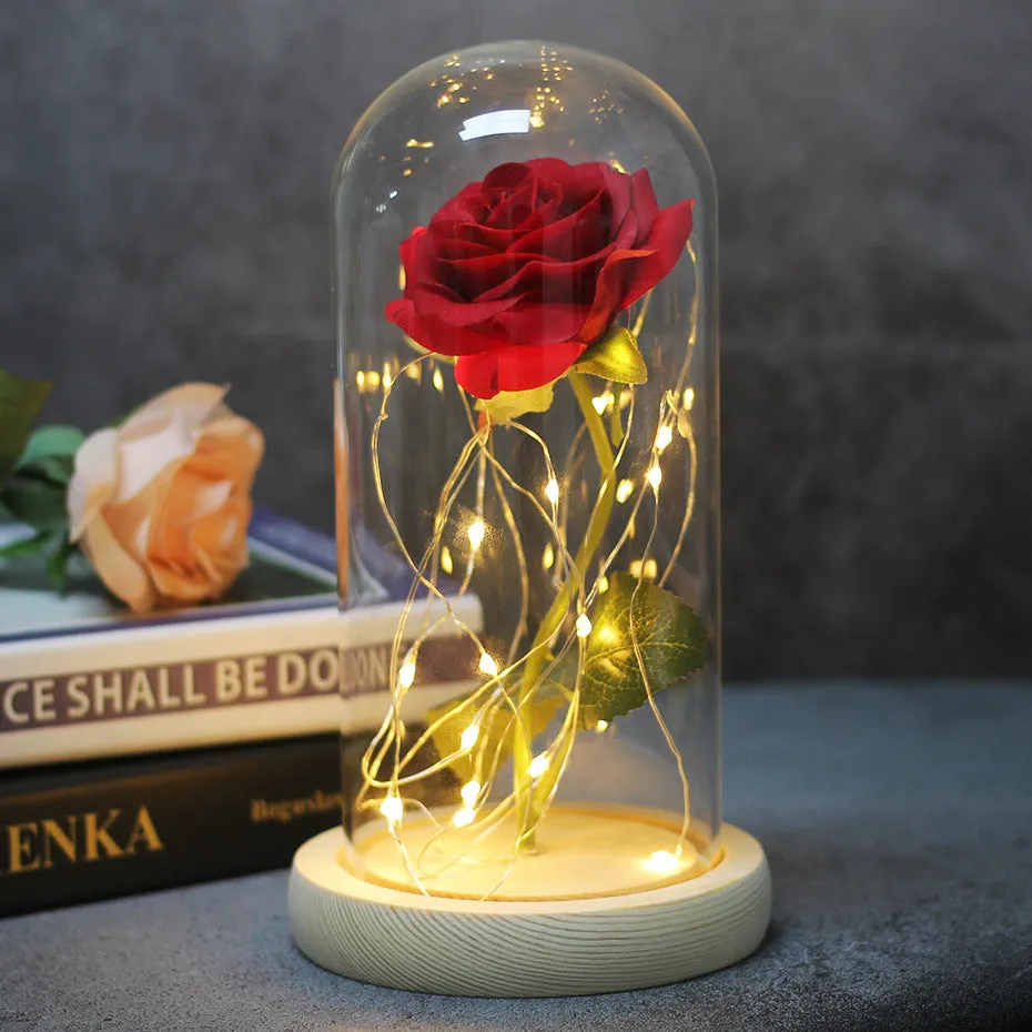Artificial silk rose LED ornament with glass lampshade showing warm white lights, available in multiple colours.