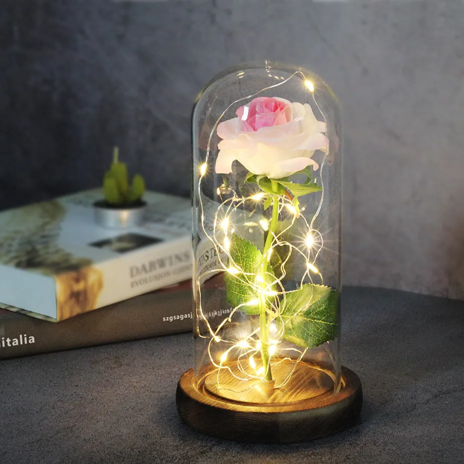 Artificial silk rose LED ornament with glass lampshade showing warm white lights, available in multiple colours.