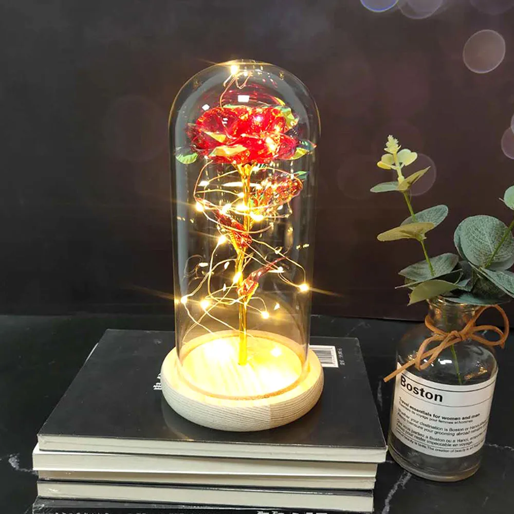Artificial silk rose LED ornament with glass lampshade showing warm white lights, available in multiple colours.