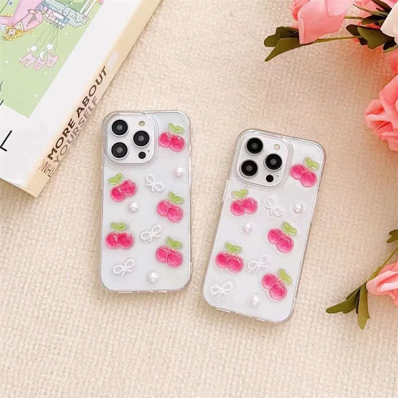 Epoxy three-dimensional cherry bow phone case in transparent finish showing decorative cherry and bow design on front