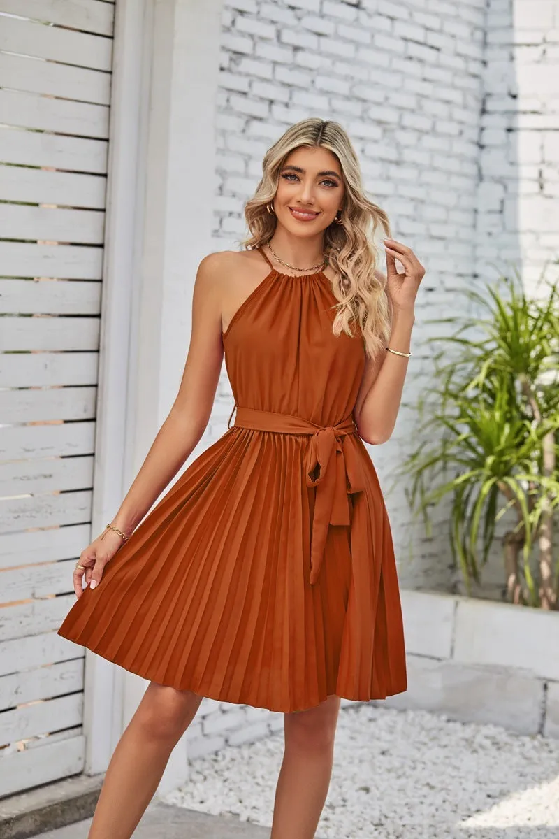 Women's black halter neck strapless sundress with a pleated chiffon skirt and an adjustable waist belt.