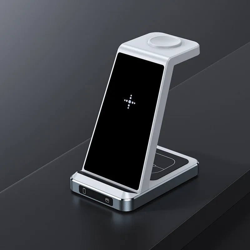 X2 three-in-one wireless charger in black charging a phone, watch, and earbuds