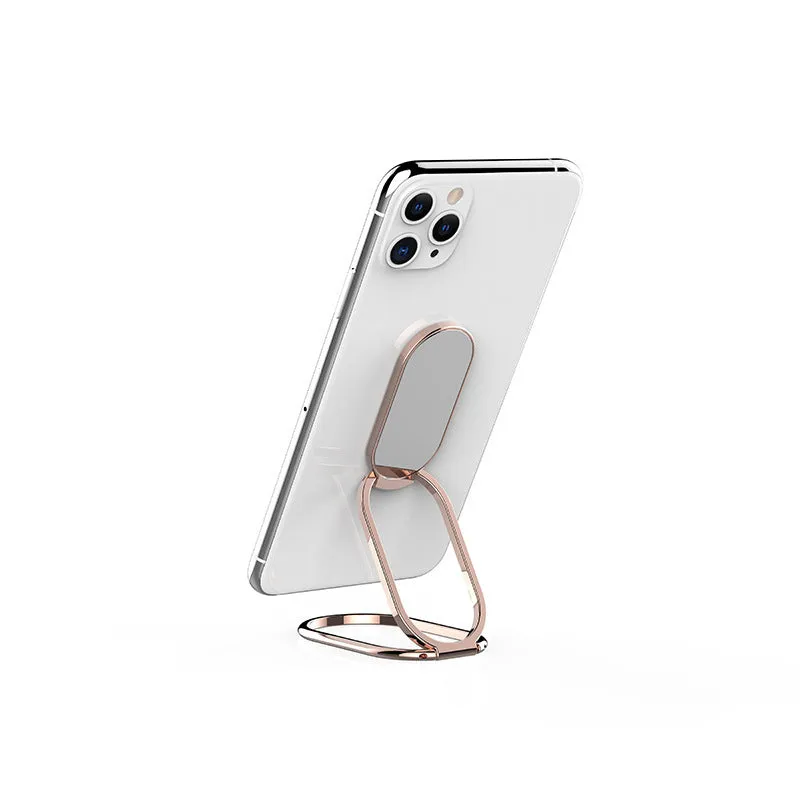 Ring buckle metal magnetic folding lazy phone holder on a desktop in black.