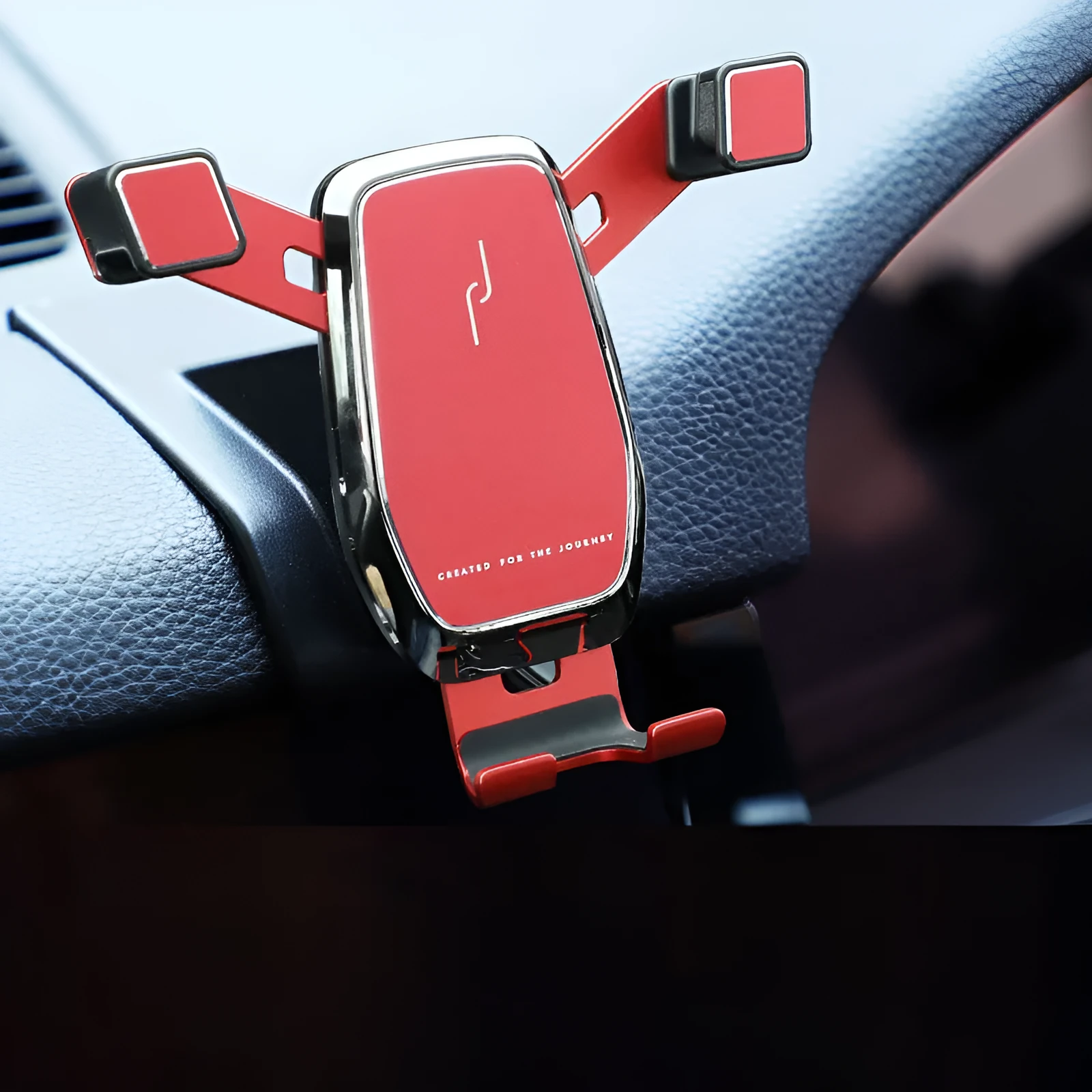 Gravity linkage car phone holder for Porsche in black alloy and carbon fibre, with phone mounted for navigation