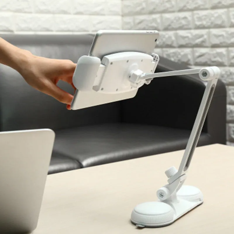 Aluminum alloy sucker bracket with double suction cup holding a tablet on a smooth surface, multi-angle rotation visible