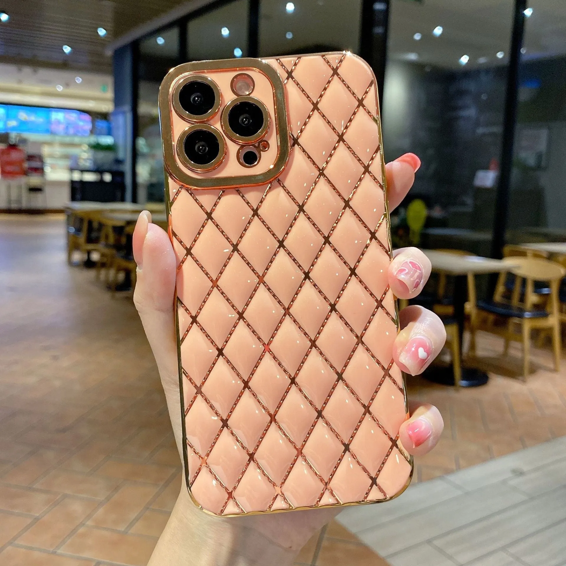 Electroplated 6D diamond TPU iPhone back cover in black, angled view with reflective pattern