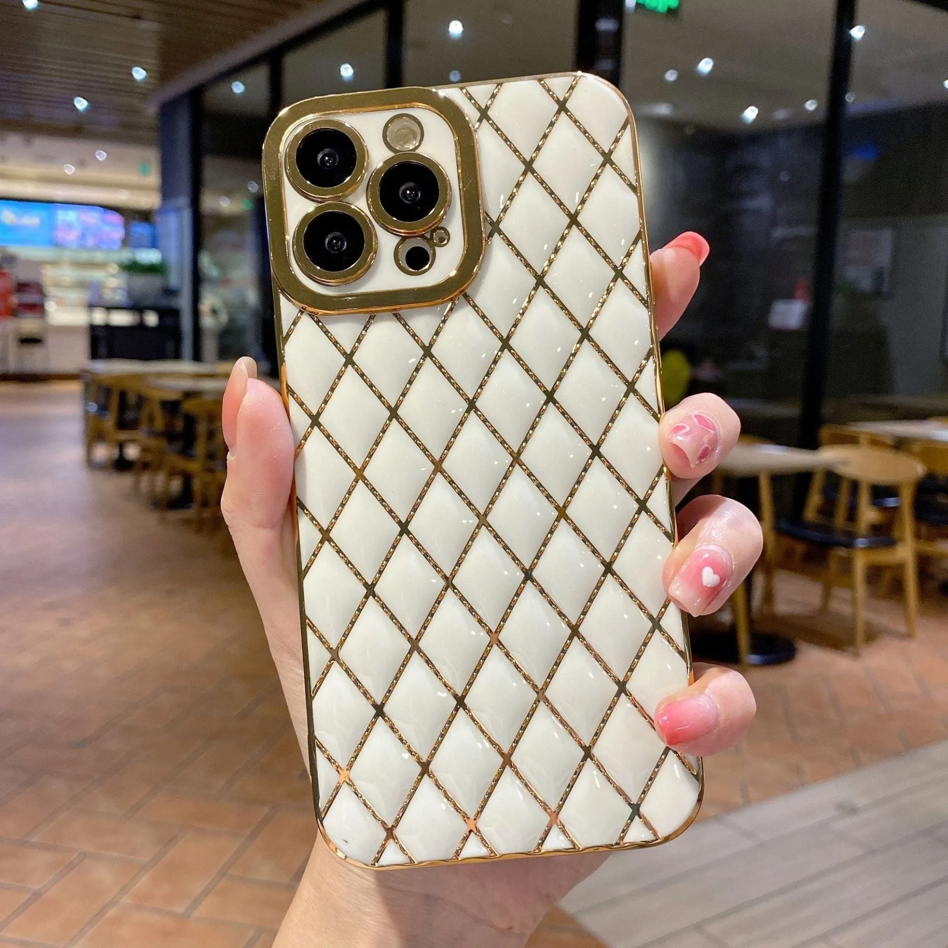 Electroplated 6D diamond TPU iPhone back cover in black, angled view with reflective pattern