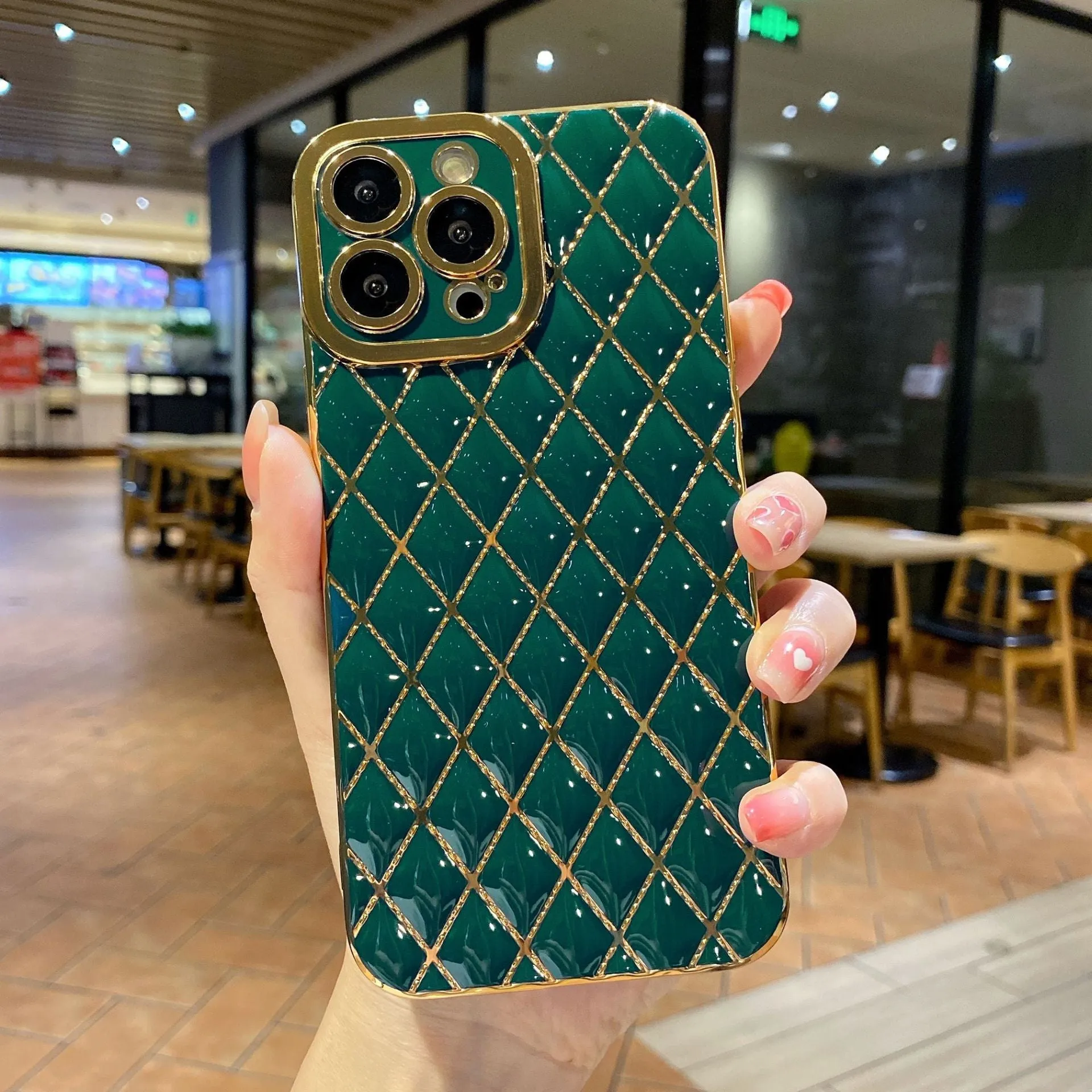 Electroplated 6D diamond TPU iPhone back cover in black, angled view with reflective pattern