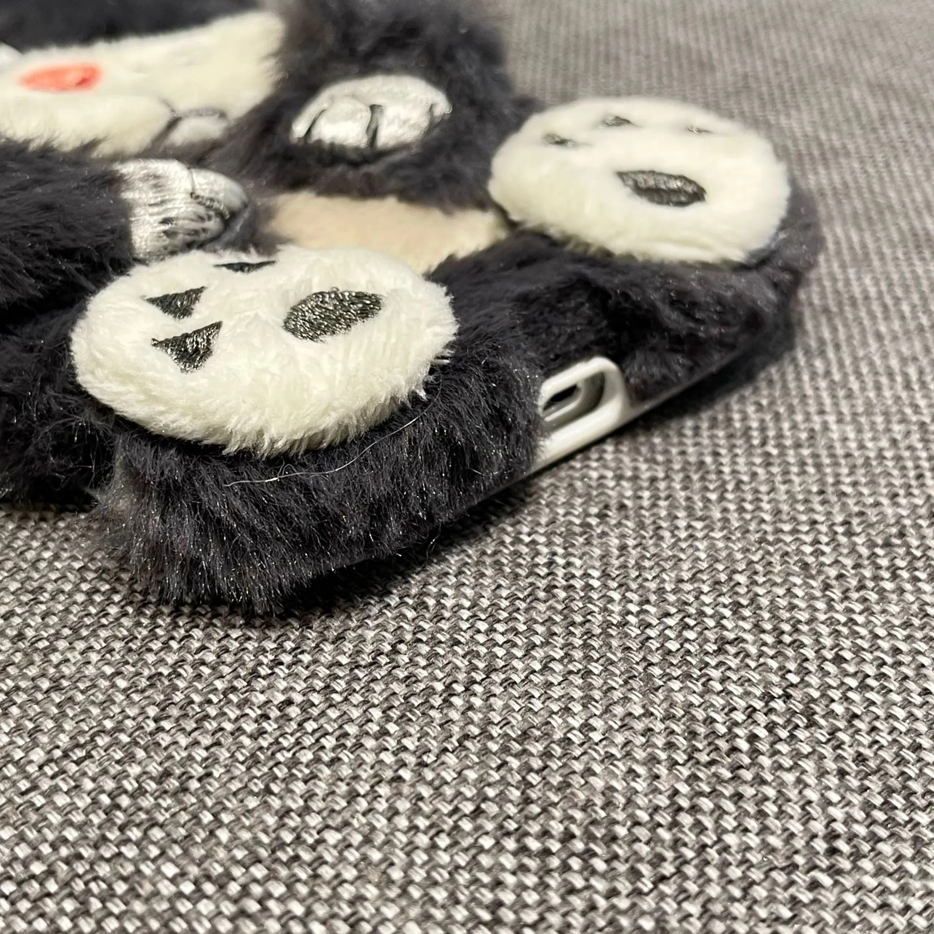 Plush staring cat phone case for iPhone with soft furry texture and love lens design