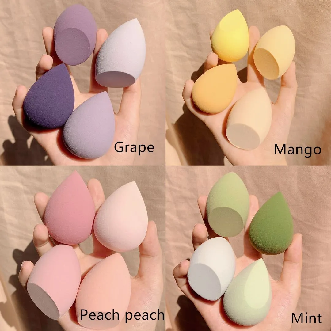Four coloured synthetic makeup sponge eggs in grape, mango, mint and peach peach