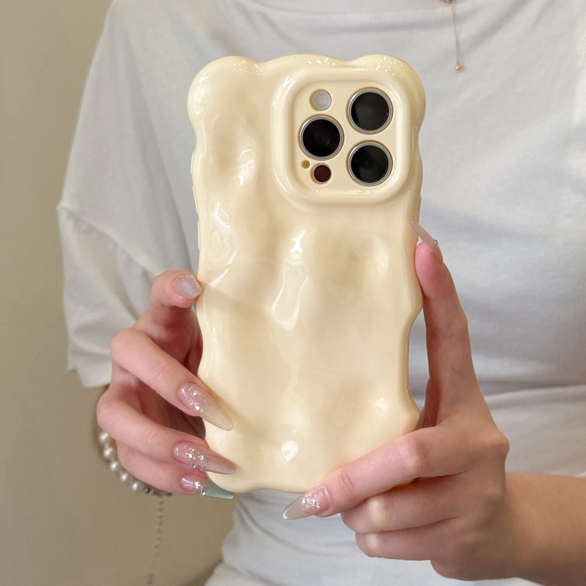 Solid colour wave shell TPU phone case in cream yellow for iPhone 14 Pro