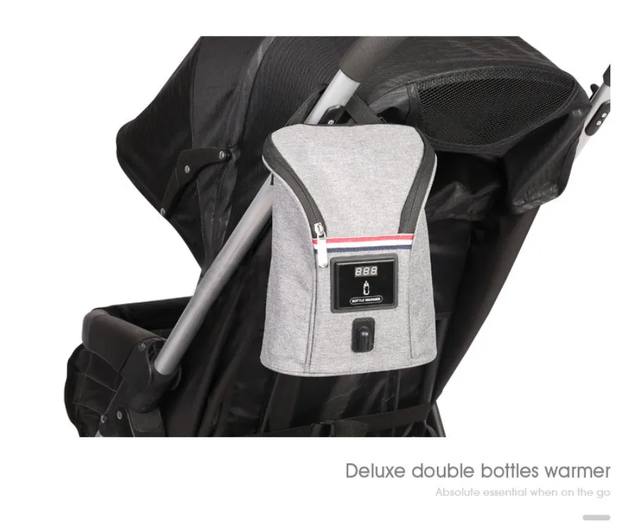 Grey Oxford cloth portable car USB baby bottle warmer with display, shown with two bottles and a 12V car charger.