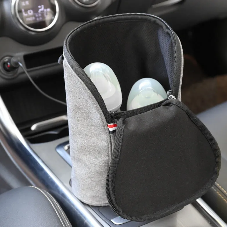 Grey Oxford cloth portable car USB baby bottle warmer with display, shown with two bottles and a 12V car charger.