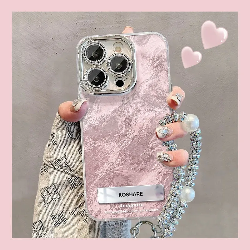 Ice blue gradient hard PC phone case with invisible bracket and silver chain for iPhone set on a white surface