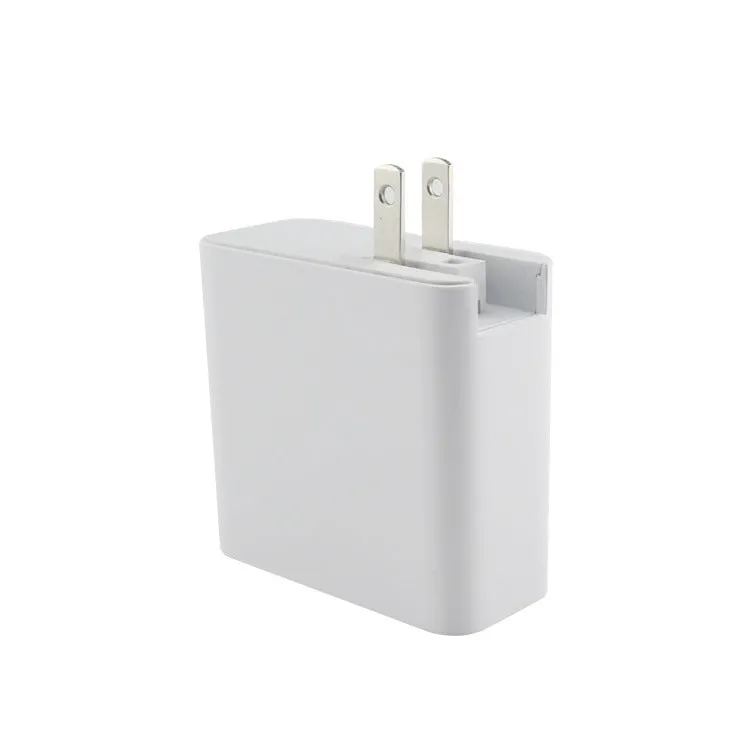Black and white four-port USB-C wall charger with UK, US, EU, and AU plug options.
