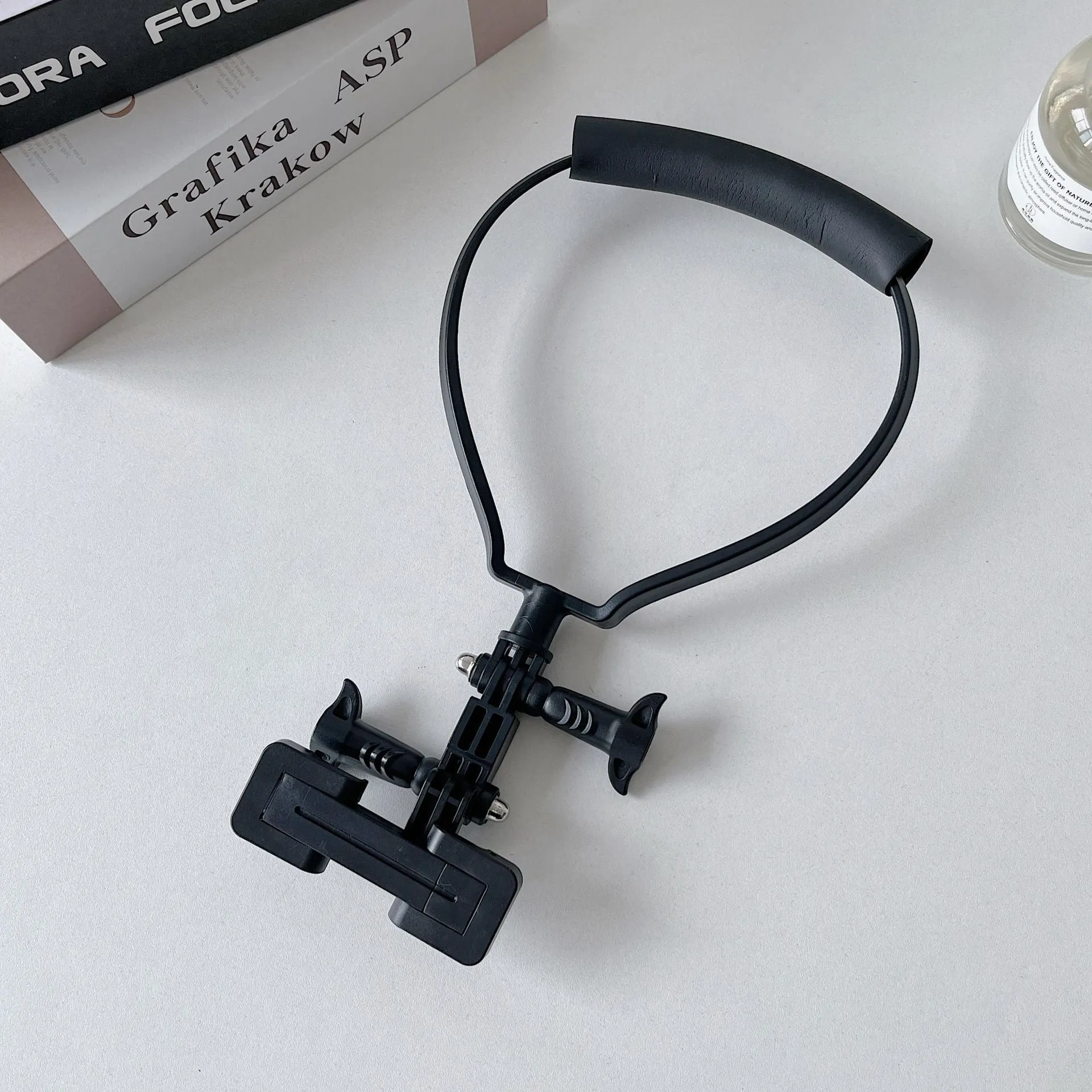 Black plastic cell phone neck hanging bracket with anti slip cushion and extension for horizontal vertical shooting